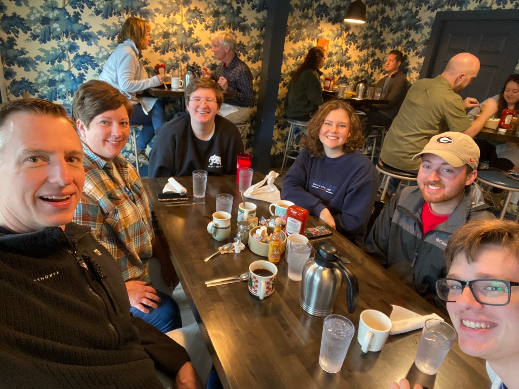 The Wallaces at a table in the Blue Bicycle Cafe in Highlands, N.C.
